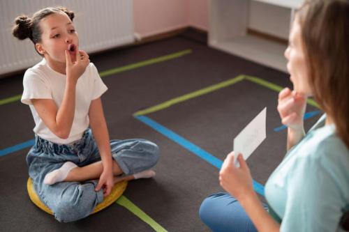 psychologist-helping-little-girl-speech-therapy-indoors